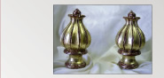 Gilded finials over mahogany