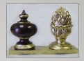 Mahogany finial trimmed with gold leaf; gold leaf over burgundy